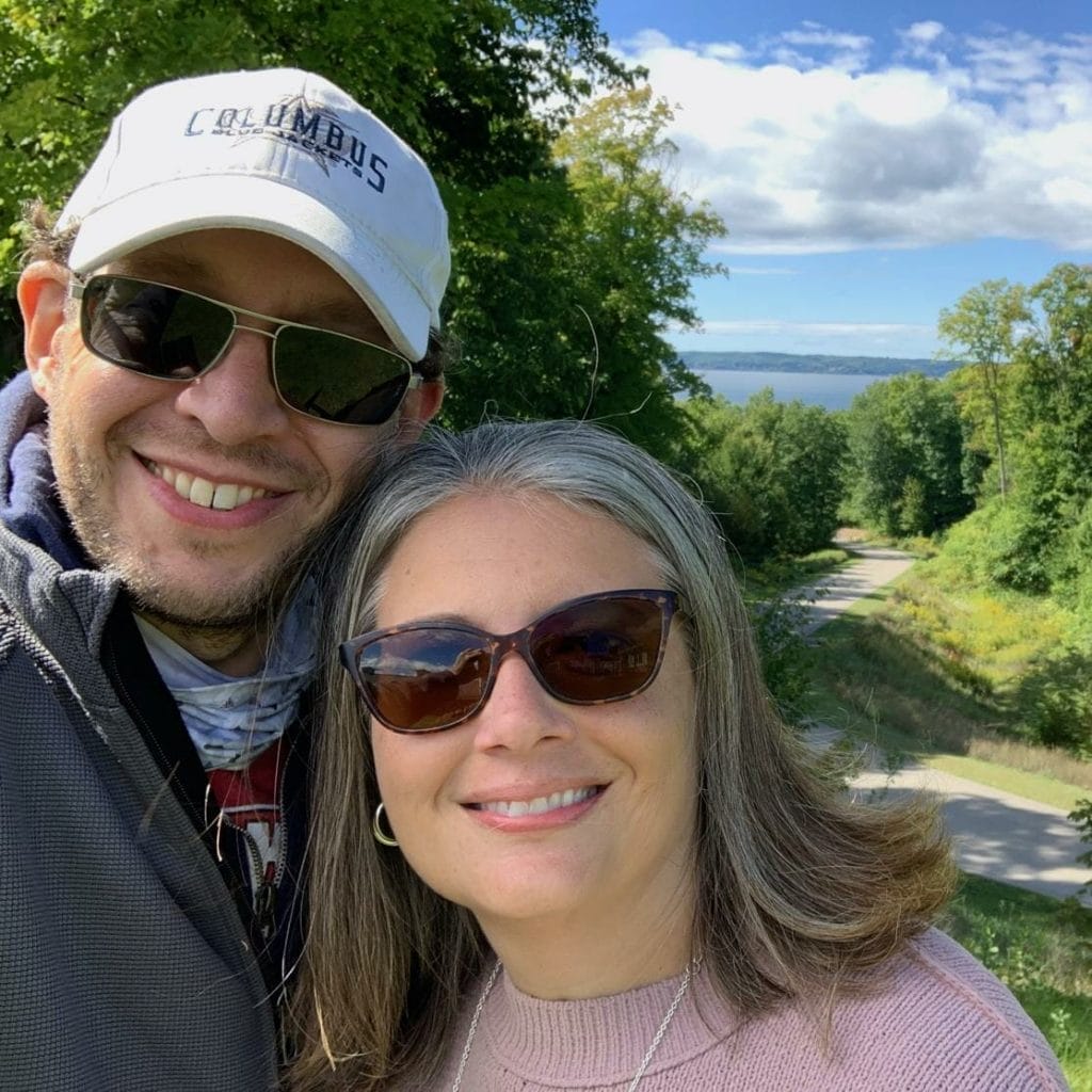 Amy and Aaron Albert, a man and woman, are taking a selfie on a trail as part of the Donor Spotlight.