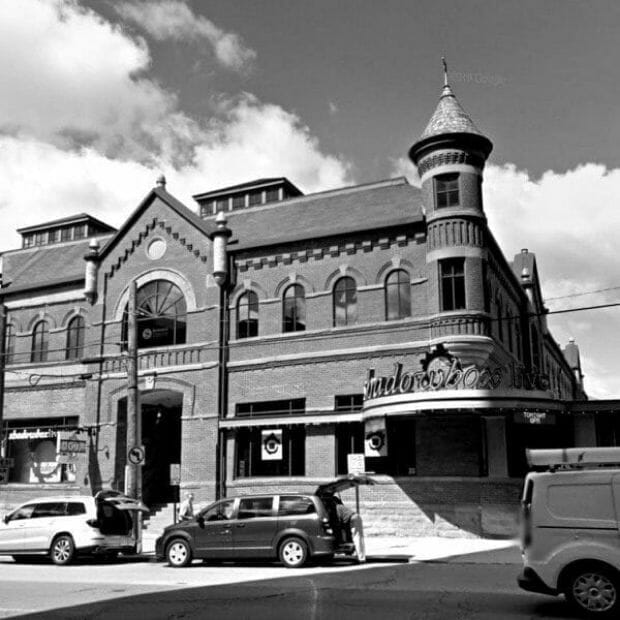 A black and white photo of an old building.